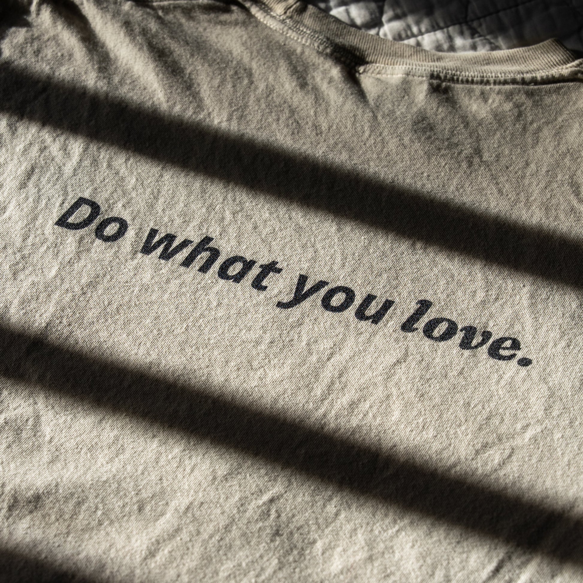 Ivory fabric with 'Do what you love' text in black