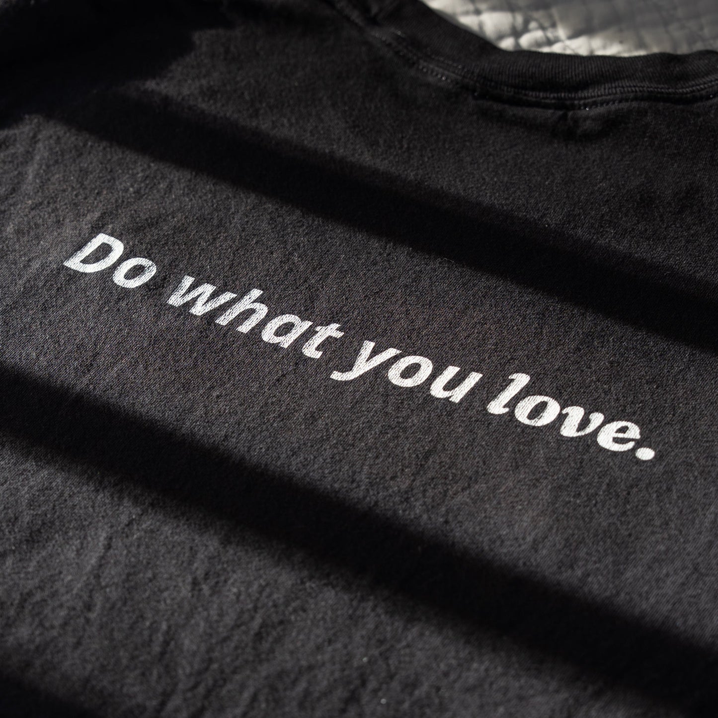 Black fabric with 'Do what you love' text in white