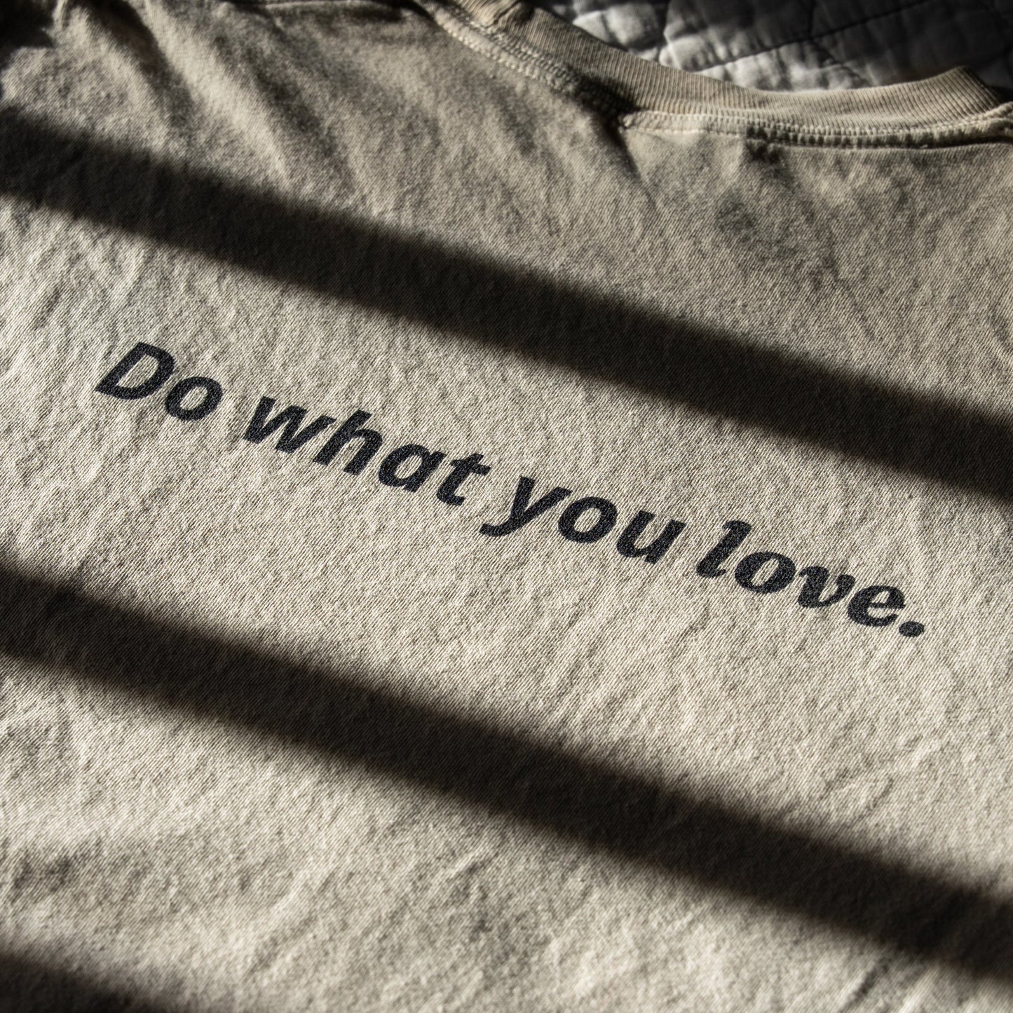 Ivory fabric with 'Do what you love' text in black